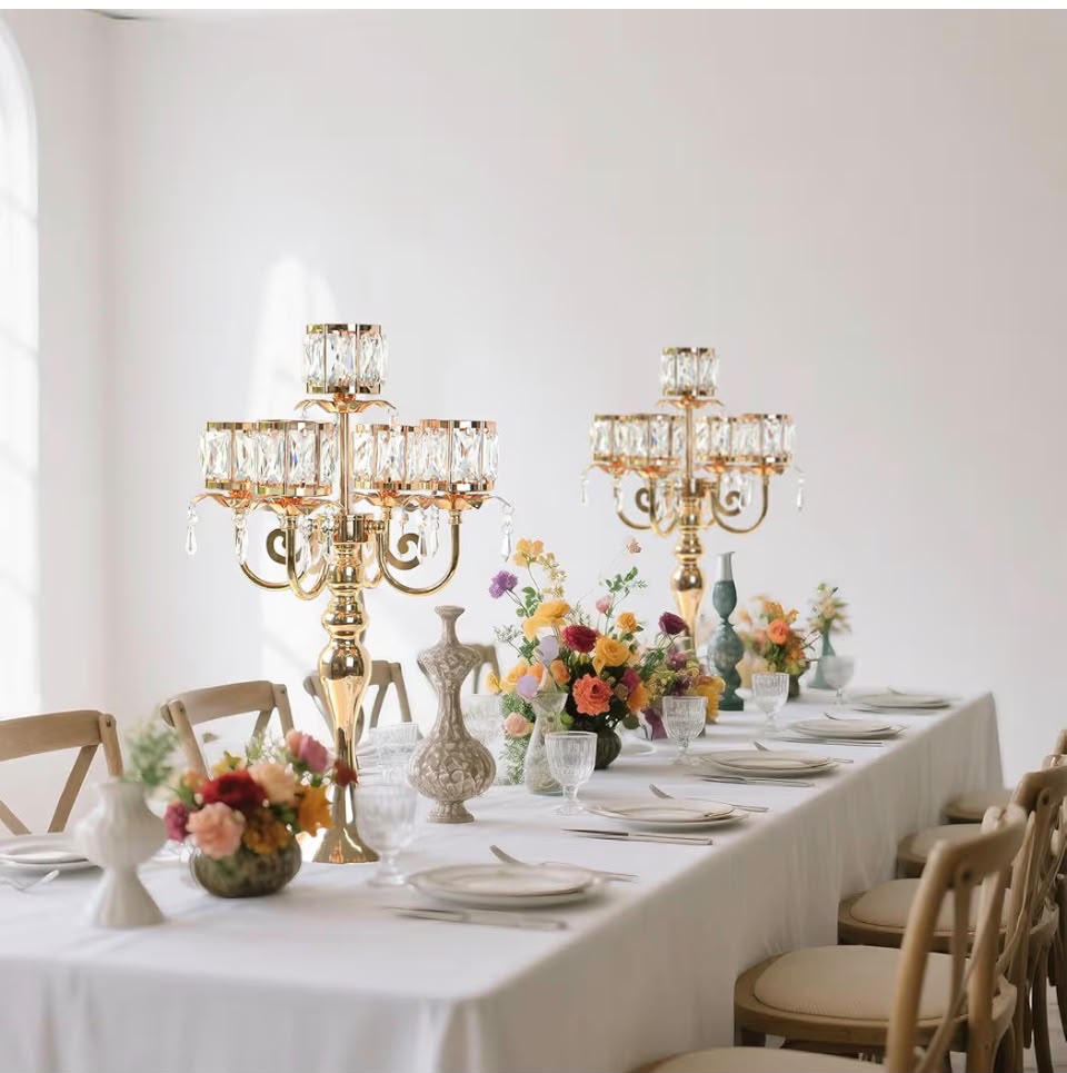 Elegant wedding tablescape with candles and roses
